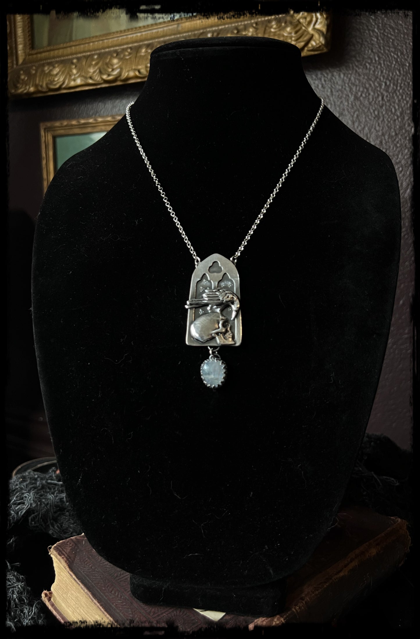 Haven Noir~Made to order~Hand crafted sterling and fine silver cathedral window with raven perched on human skull with a rose cut rainbow moonstone droplet necklace ~