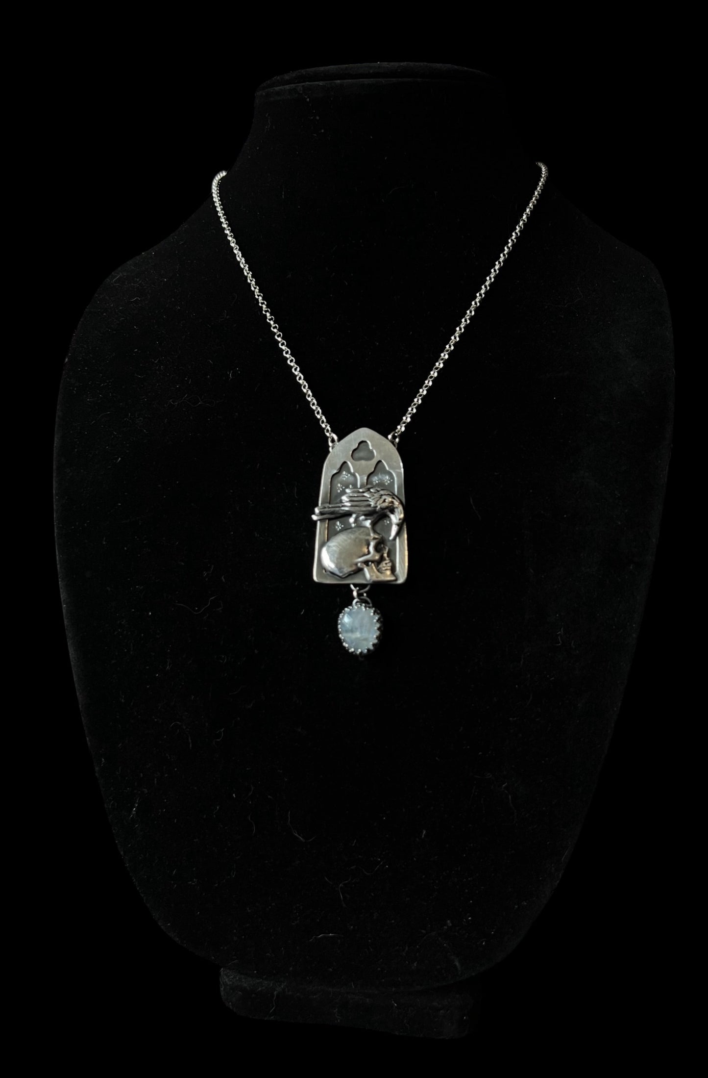 Haven Noir~Made to order~Hand crafted sterling and fine silver cathedral window with raven perched on human skull with a rose cut rainbow moonstone droplet necklace ~