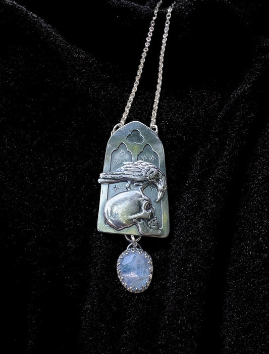 Haven Noir~Made to order~Hand crafted sterling and fine silver cathedral window with raven perched on human skull with a rose cut rainbow moonstone droplet necklace ~